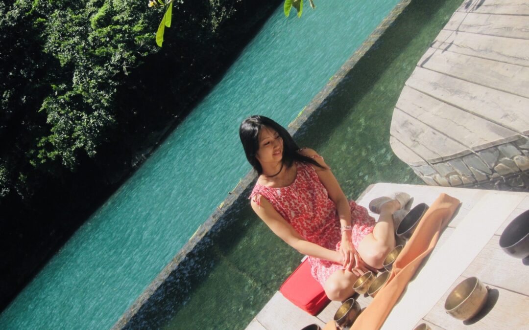 dr lily chen sitting by a pool