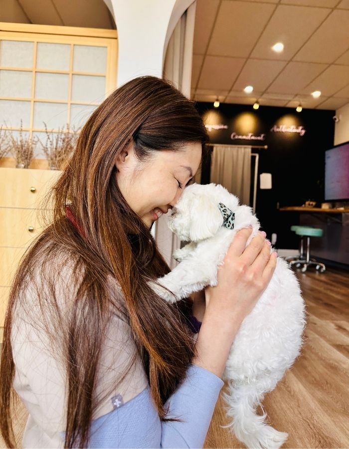 vet with pet Vet holding a puppy