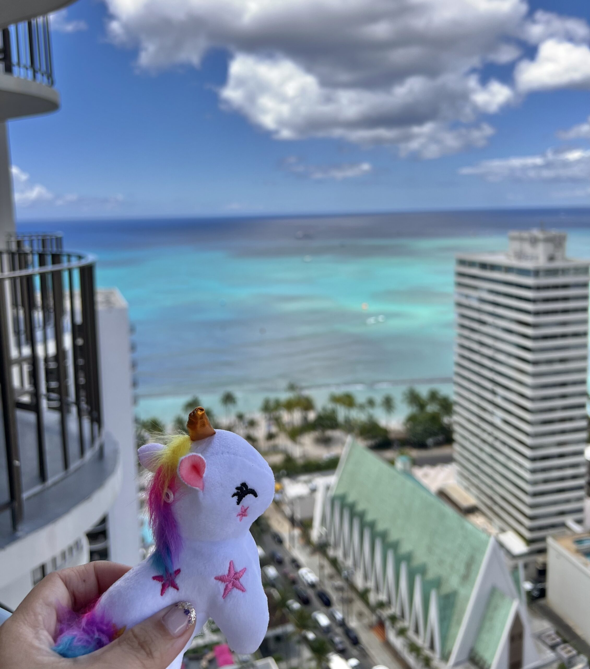 startlight-stories A person holding a plush unicorn toy in hand