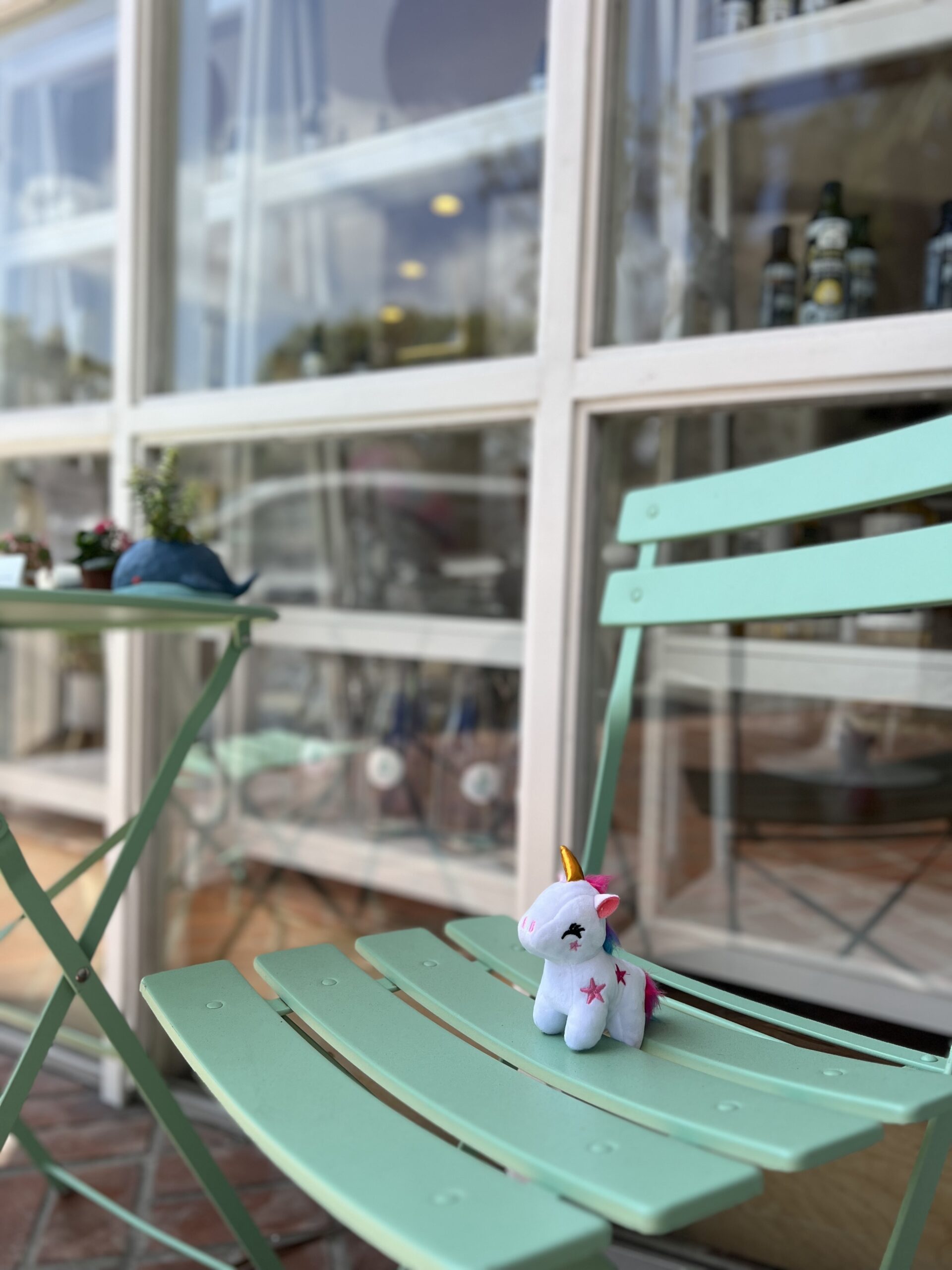 startlight-story-img-june unicorn toy on a chair