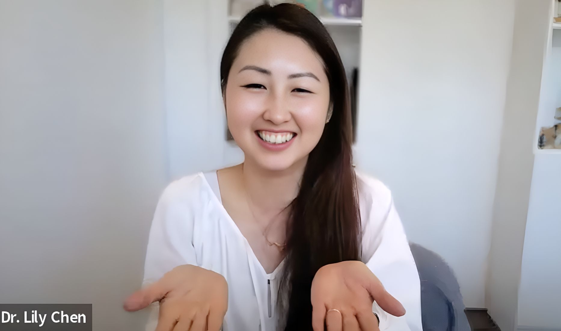 Dr. Lily Chen smiling in a white coat at Integrative Pet